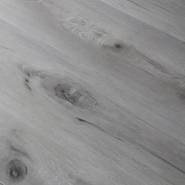 Light gray SPC flooring with natural wood grain.