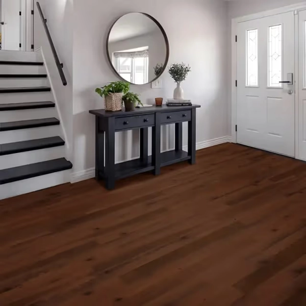 Modern entryway with dark wood floors and console