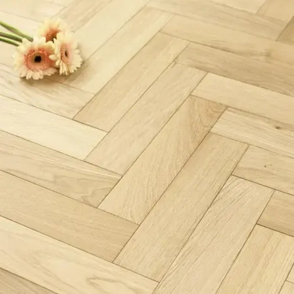Chevron SPC flooring with angled wood grain pattern.