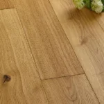 Close Up Of Oak Floorboards And White Flowers