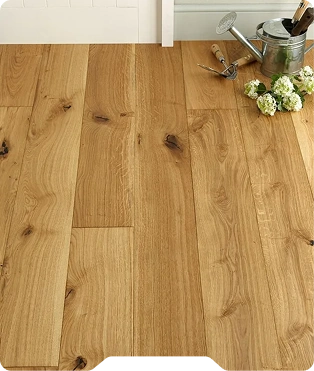 Wide View Of Natural Oak Floor With Garden Tools And Flowers